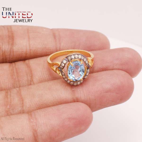 Oval Sky Blue Topaz Halo Ring