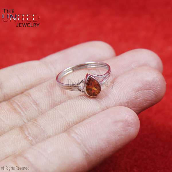 Metal: Certified 925 Sterling Silver (High-Polish Mirror Finish) Main Stone: Natural Cognac Amber (or Citrine) Pear-Shaped Cabochon Design: Modern split-shank band with a sleek teardrop bezel setting Style: Minimalist / Boho / Nature-Inspired Features: Lightweight for daily comfort, hypoallergenic, and stackable Symbolism: The teardrop shape represents grace and emotional clarity